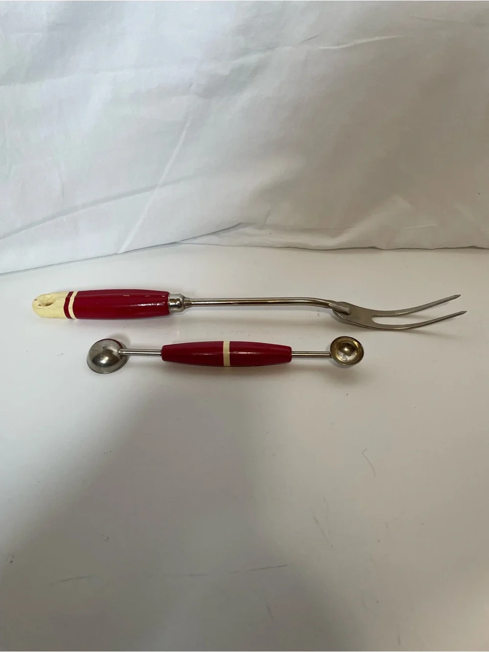 Vintage meat fork and matching melon baller